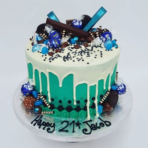 Teal and White Chocolate Drip with Blue Toppings