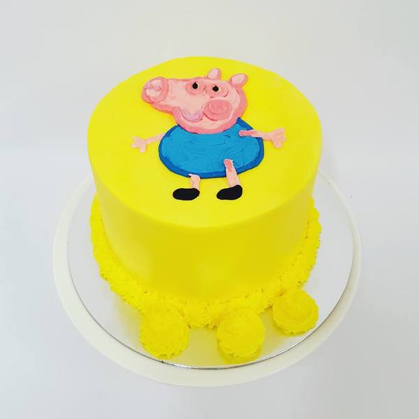 Smooth Yellow Cake with Piped George the Pig